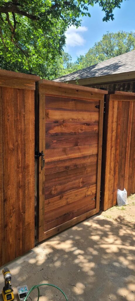 Modern horizontal plank cedar gate with clean contemporary lines