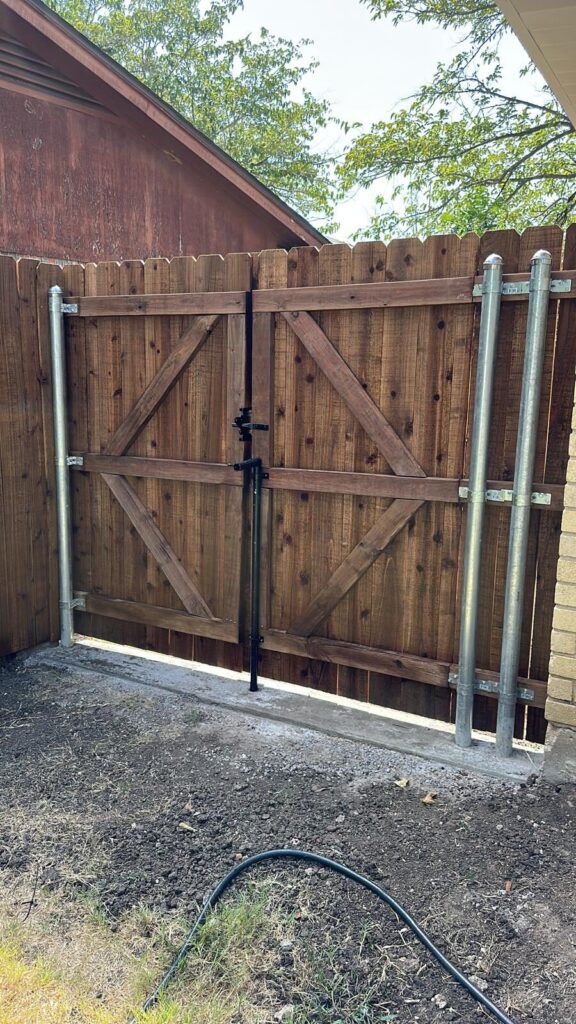 Cedar double gate hung on galvanized steel posts with Z-brace framing