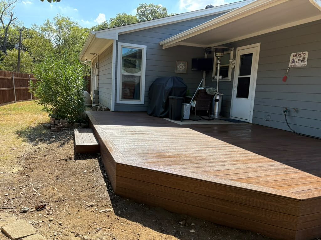 Composite deck extending beyond a patio cover into the backyard