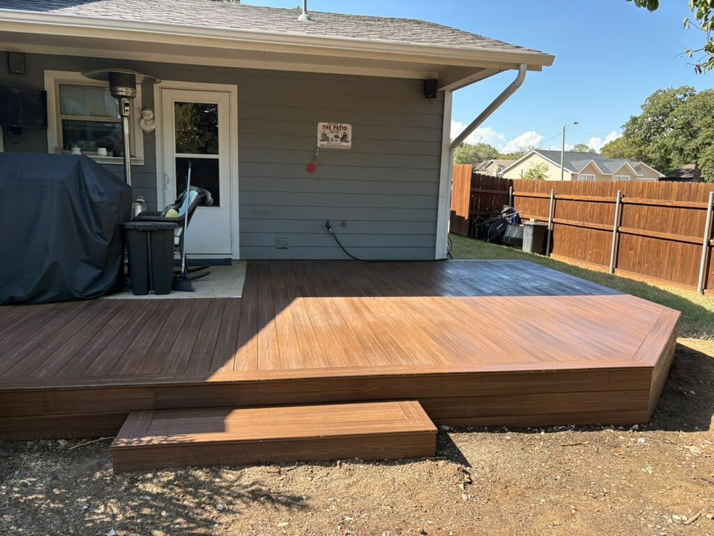 Composite deck with a wide matching step down to the yard